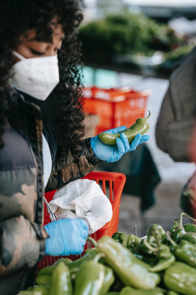 lady in supermarket with veggies